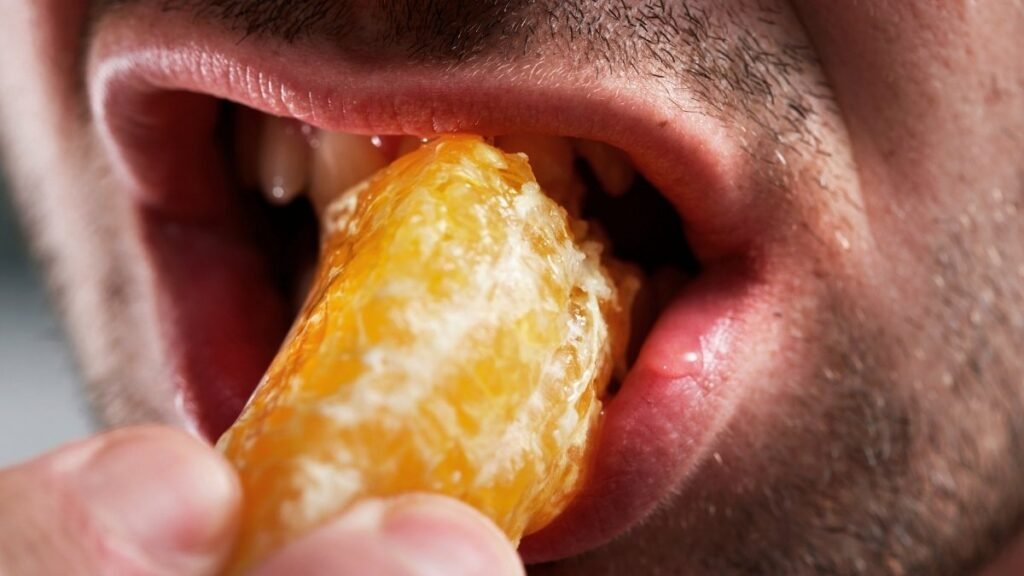 Man-eating-fruit-close-up