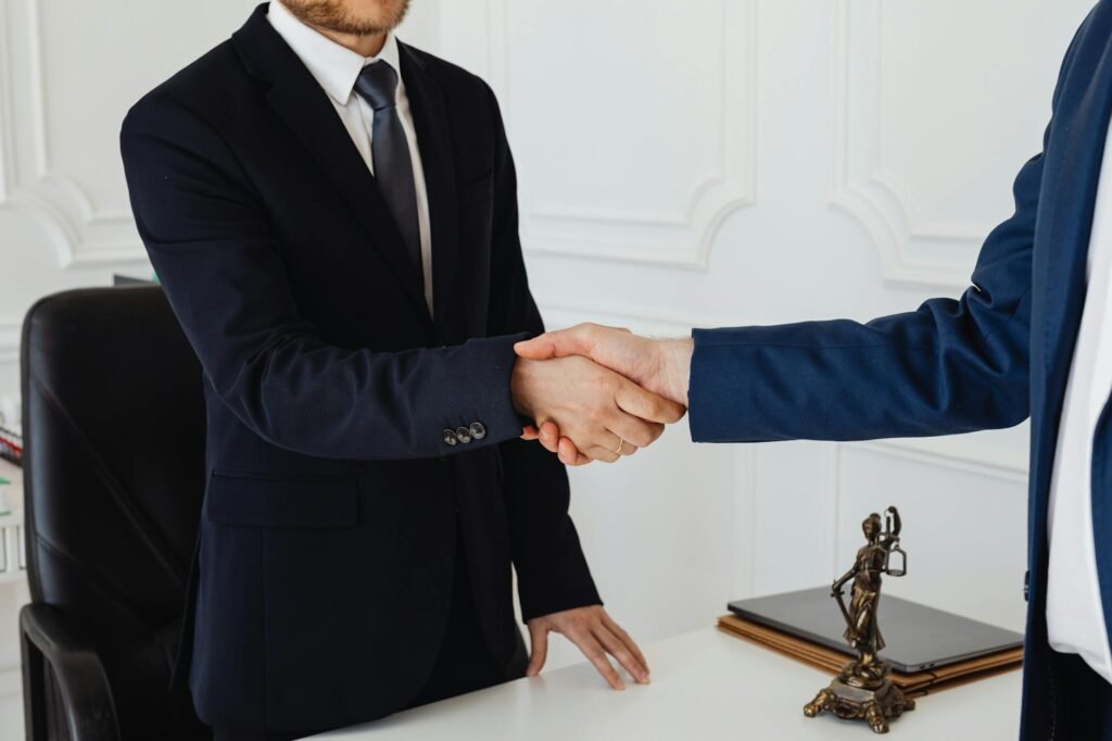 BerryDunn hires COO - business leaders handshake office professional business image