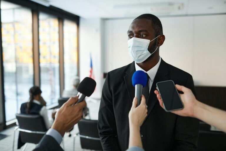 BuzzFeed survival - BuzzFeed newsroom crisis meeting" professional business image