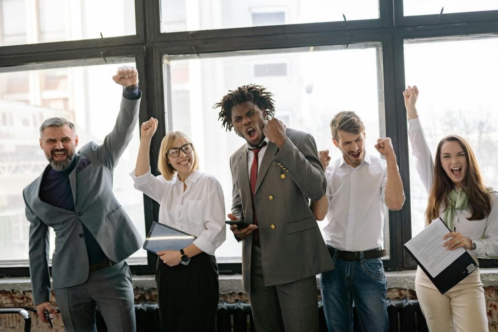Mirabella acquires Cintas stake - business professionals celebrating acquisition professional business image